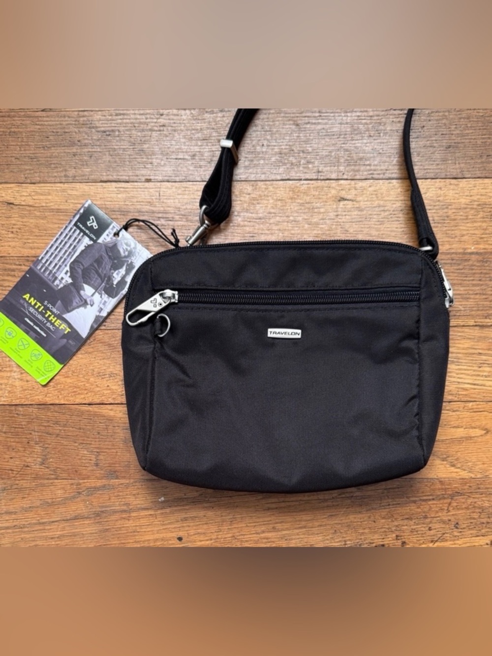 Travelon black fabric anti-theft security crossbody bag.